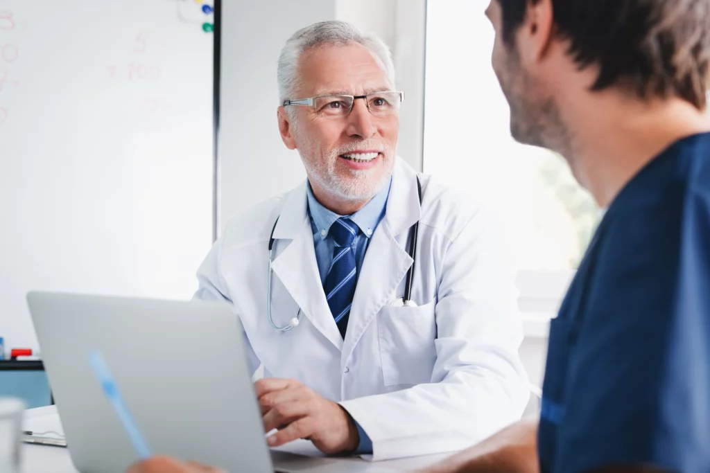 doctor discussing medical results with male patient